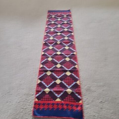 Scarf rectangular geometric pattern in red blue. Unmarked. 43 x 9.75 in.